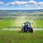 tractor crop spray farm fields herbicides