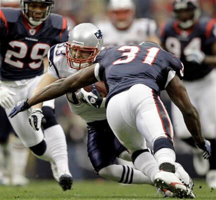 New England Patriots wide receiver Wes Welker (83) is hit by Houston Texans safety Bernard Pollard (31) after a catch good for a first down during the first quarter of an NFL football game Sunday, Jan. 3, 2010, in Houston. Welker was injured on the play and taken off the field on a cart. (AP Photo/David J. Phillip)