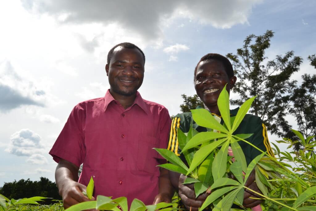 A-woman-group-leader-smiles-along-with-their-extension-worker-inside-the-tissue-culture-derived-cassava-field-1024x683