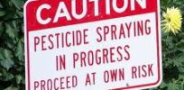 caution pesticide spraying in process