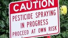 caution pesticide spraying in process