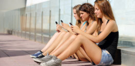 teenage girls with phones