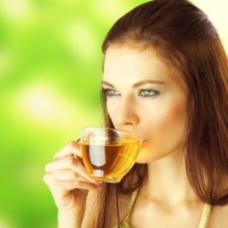 young female drinking green tea