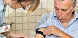 Nurse taking blood from man