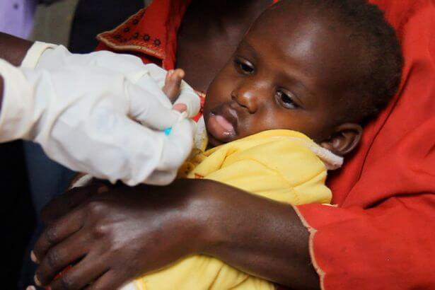 PROD Baby girl being tested for malaria