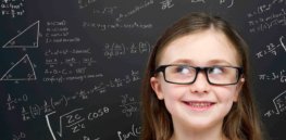 smart girl in front of blackboard