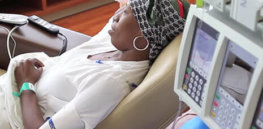 woman with headscarf getting chemo treatment article v e
