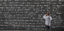 child at math blackboard