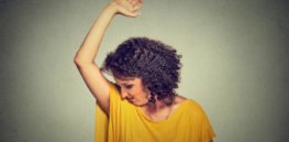 woman sniffing armpit