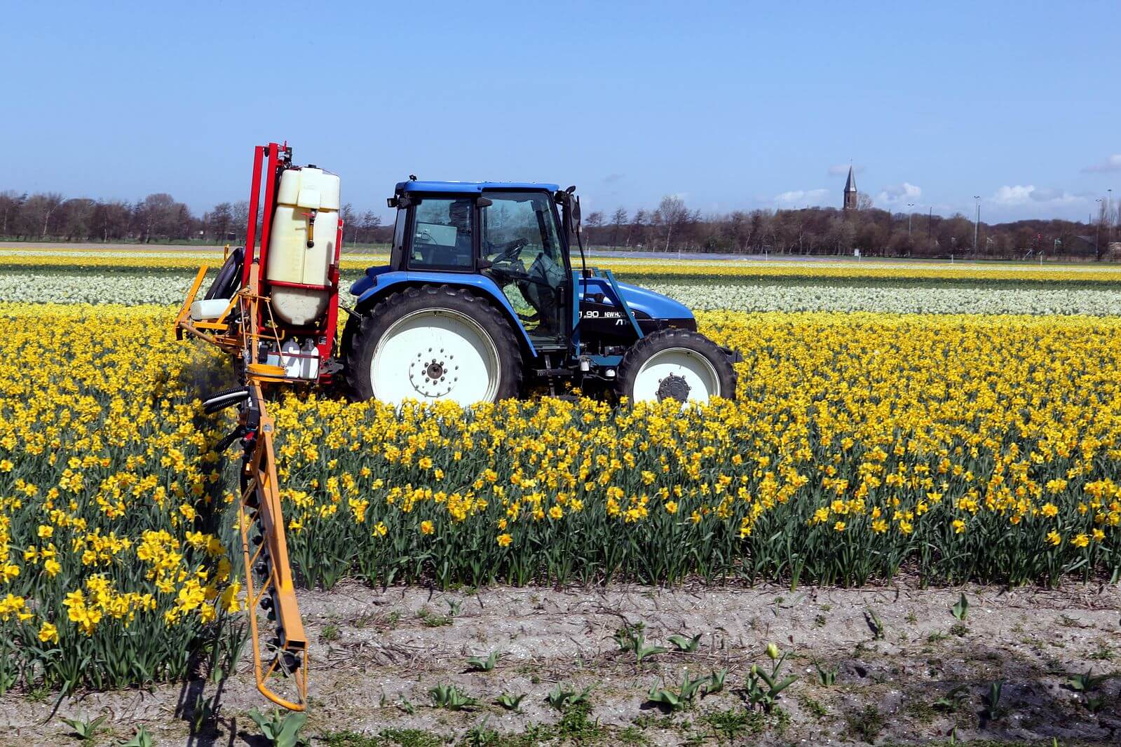 New Holland TL and field sprayer