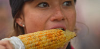 Woman eating Corn