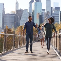 young family with daughter taking a walk on royalty free image
