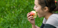 teen girl eating apple csz v