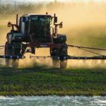 large farmer spraying crops can be used for dicamba articles