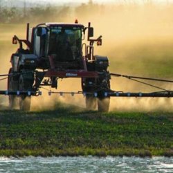 large farmer spraying crops can be used for dicamba articles