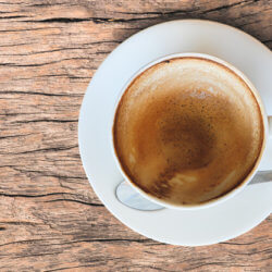 empty coffee cup after drink foam white cup old wooden table
