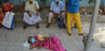 Photographs: As COVID crisis surges in India, tragedy spreads