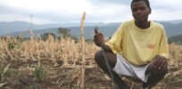 a young man in drought conditions in ethiopia