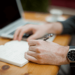 left handed writing with wristwatch