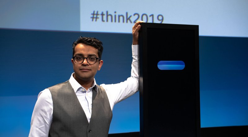 World record-holding debater Harish Natarajan poses with Project Debater, his opponent at Think 2019. Credit: IBM