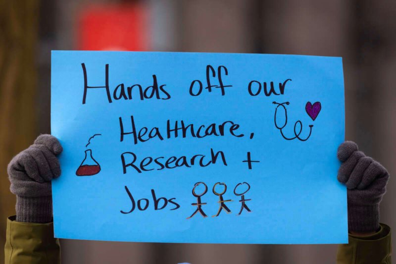 CHICAGO, ILLINOIS - FEBRUARY 19: People including researchers from Chicago area universities gather on the University of Illinois Chicago (UIC) campus to voice concerns about the potential loss of federal funding for medical research on February 19, 2025 in Chicago, Illinois. The researchers are worried about the future of their projects as the Trump administration cuts grant funding from the National Institutes of Health (NIH). (Photo by Scott Olson/Getty Images)