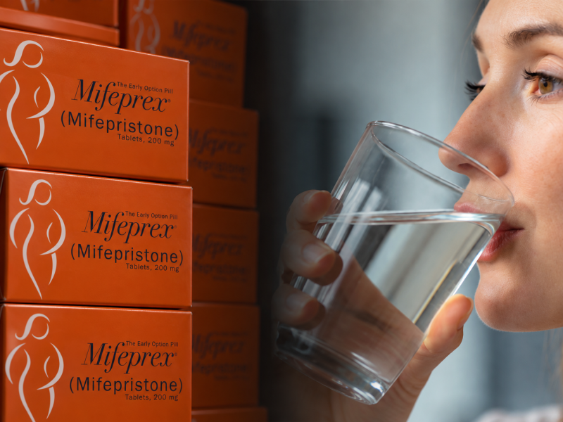 Mifeprex Boxes and Woman Drinking Water