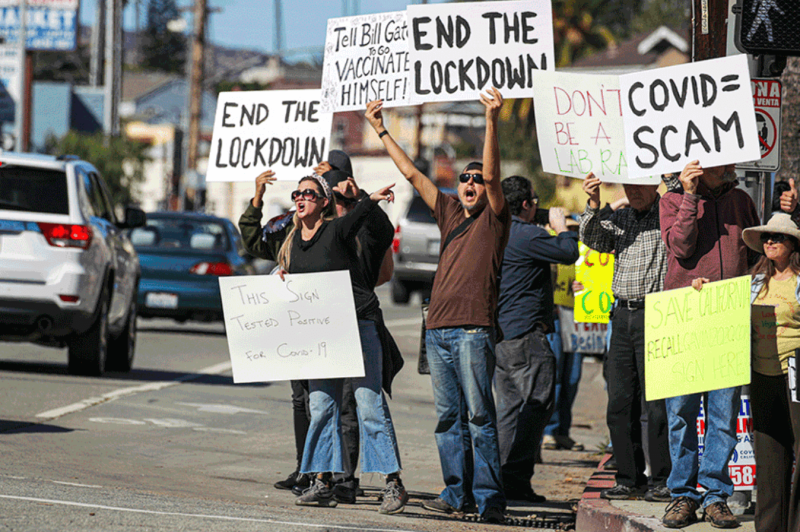 Protest at the Doger Statium COVID vaccination site. Credit: Irfan Khan/Los Angeles Times