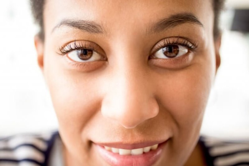 close up african female face with kind eyes