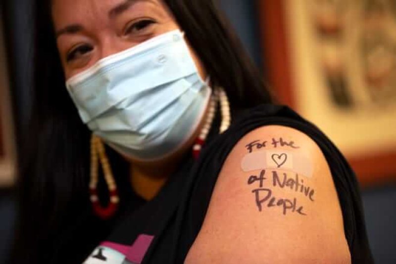Abigail Echo-Hawk, chief research officer with Seattle Indian Health Board and a member of the Pawnee Tribe gets a shot of the Moderna COVID-19 vaccine. Indigenous Americans have been underrepresented in vaccine trials. Credit: Karen Ducey/Getty Images