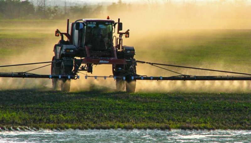 farmer spraying crops can be used for dicamba articles