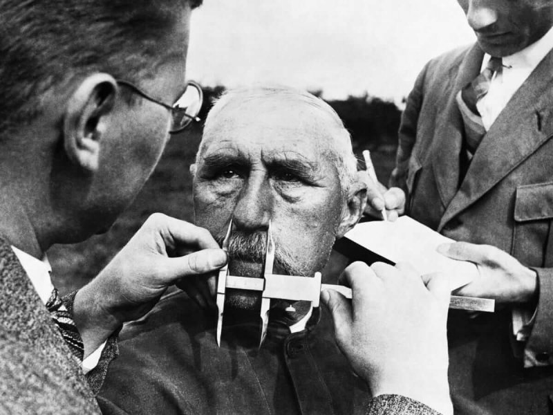 Nazi officials use calipers to measure an ethnic German's nose on January 1, 1941. The Nazis developed a pseudoscientific system of facial measurement that was supposedly a way of determining racial descent. Credit: Hulton-Deutsch Collection/CORBIS/Getty Images