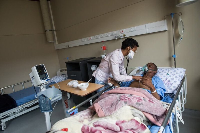 Dr. Lokuthula Maphalala with a coronavirus patient at Dora Nginza, a public hospital in Port Elizabeth that was overwhelmed by the recent surge in Covid cases. Credit: Samantha Reinders/New York Times