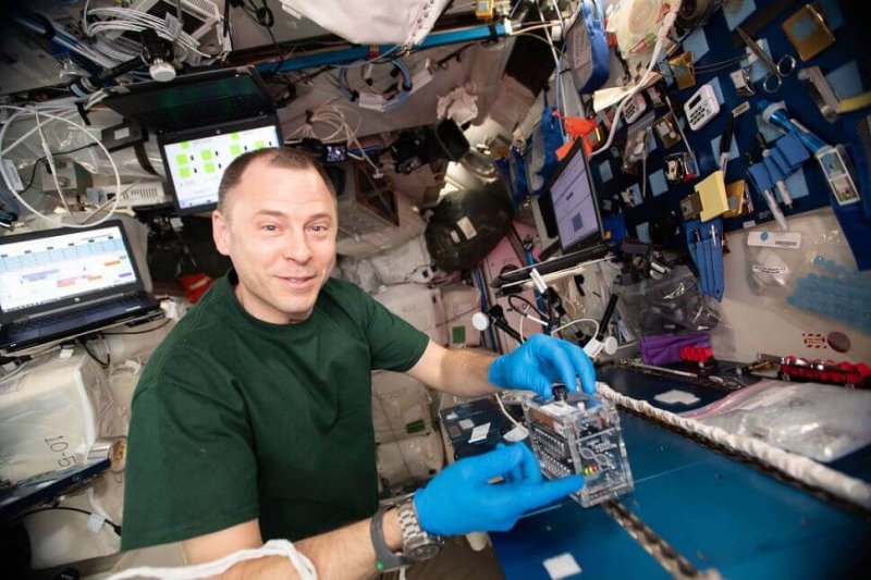 NASA astronaut Nick Hague using the miniPCR hardware to explore how space radiation damages DNA. Credit: NASA