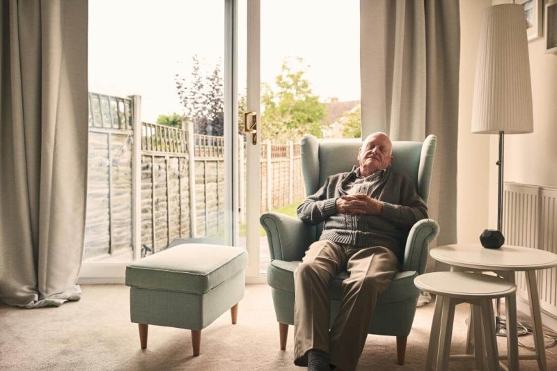older man resting in an armchair