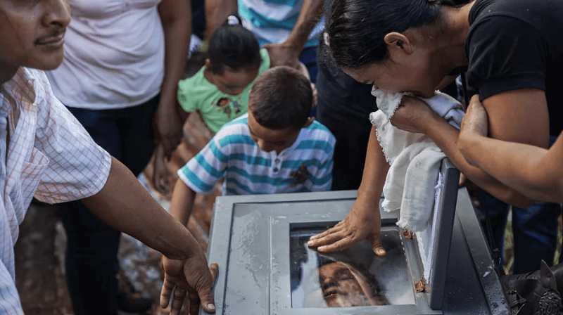 This is not the first time kidney disease has swept across Central America. Loved ones express their grief at the burial of Ramon Romero Ramirez in Chichigalpa, Nicaragua, January 2013. Ramirez is part of a steady procession of deaths among cane workers. Credit:
Ed Kashi and VII