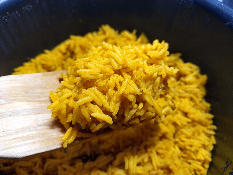 Golden "Malusong" Rice has a yellow hue which is argued to be a product of zeaxanthin and lutein synthesis. The appearance is similar to this yellow rice. Credit: Veikko Mäkelä via CC-BY-SA-4.0