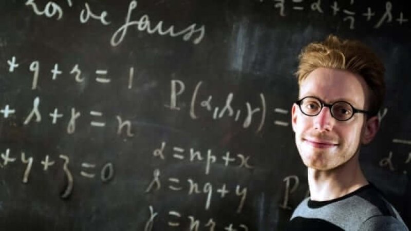 British autistic writer Daniel Tammet poses at a science museum in Paris, as part of the first Pi Day in France. Tammet holds the European record for reciting pi from memory to 22,514 digits. Credit: Lionel Bonaventure/AFP/Getty Images