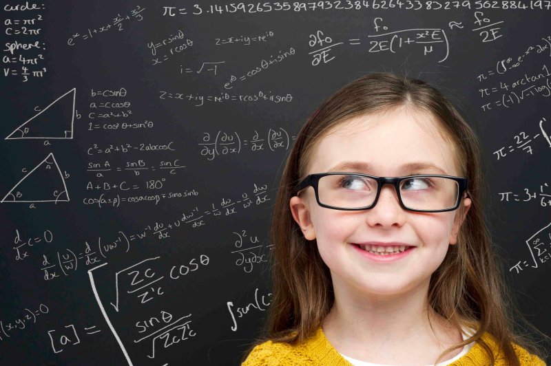 smart girl in front of blackboard