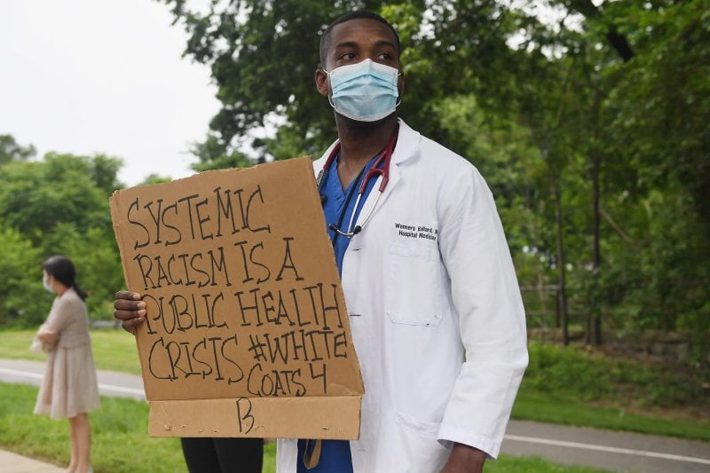 Protestor in St. Louis, MO after the death of George Floyd. Credit: STAT News