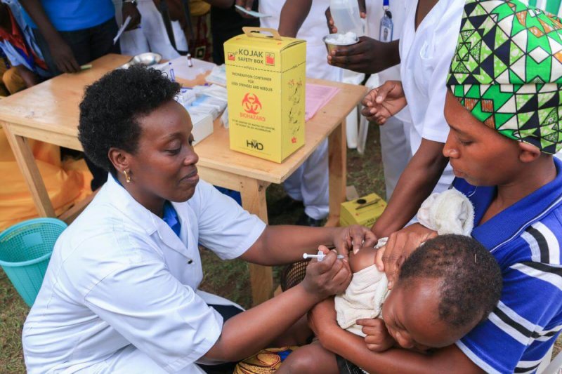 the minister of health dr diane gashumba providing measles and rubella vaccine
