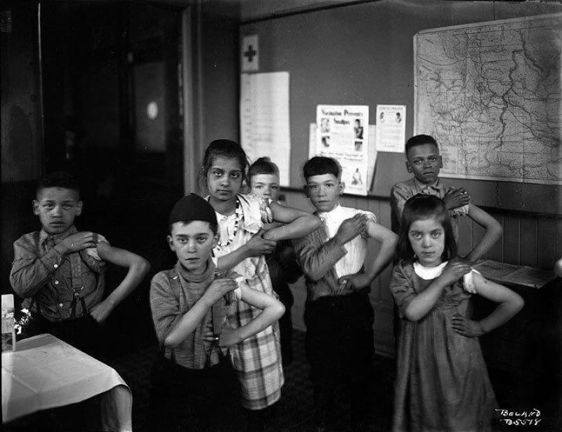 School children in Tacoma showing off their new vaccinations, likely for smallpox or diphtheria, in 1922. Credit: Washington State Historical Society