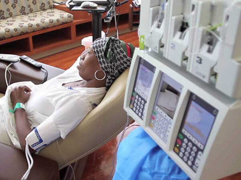 woman with headscarf getting chemo treatment article v