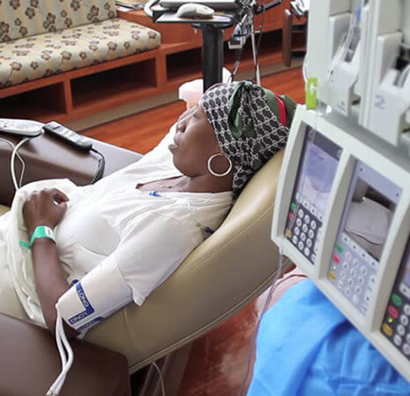 woman with headscarf getting chemo treatment article v e